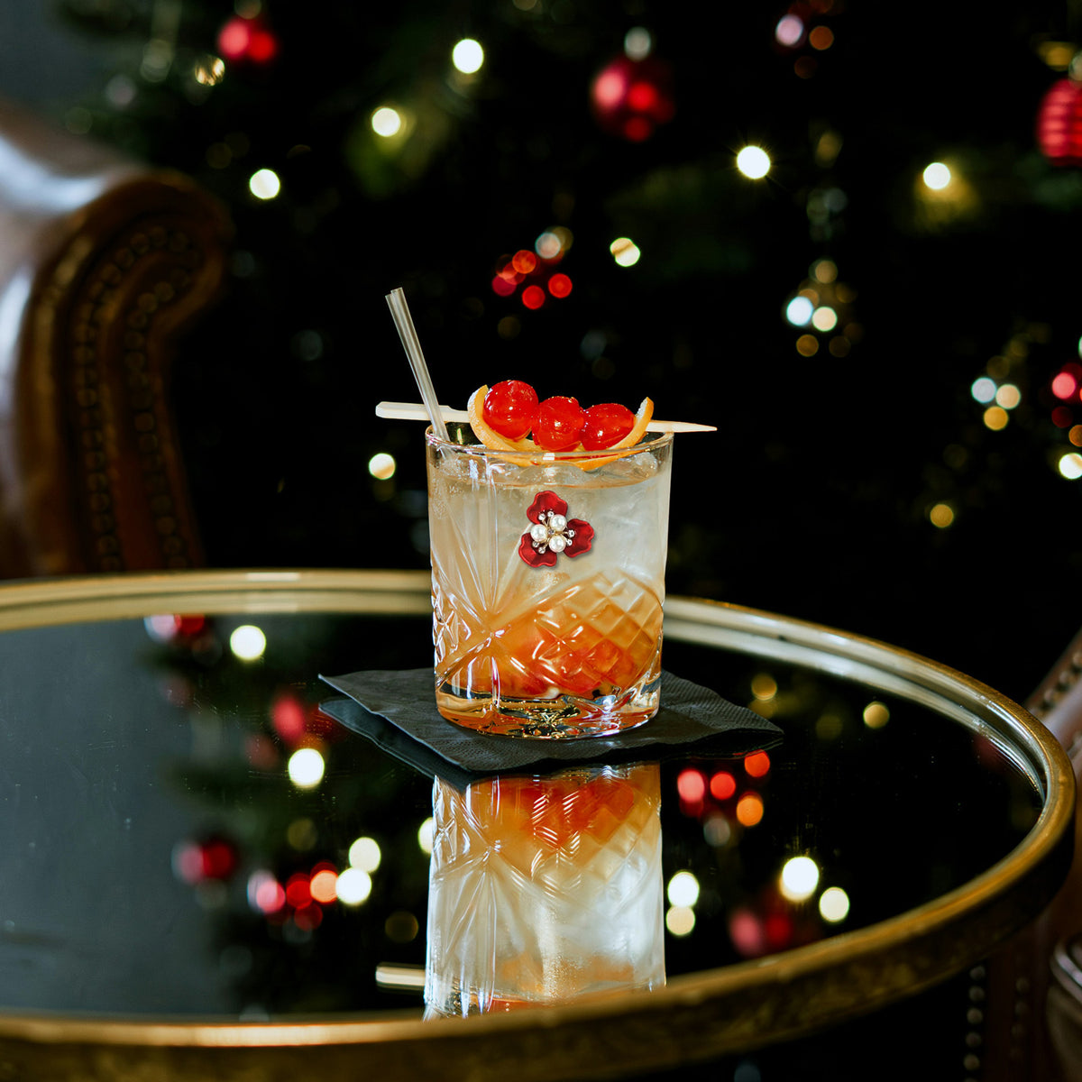 a glass with a drink on a table